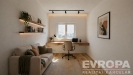 Dom�c� kancel�� s d�ev�nou podlahou, velk�m oknem a modern�m osv�tlen�m. Stylov� prostor s minimalistick�m designem a pohodln�m n�bytkem.